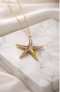 Colgante estrella,de plata con detalles dorados,y peridoto(olivina),tamaño del colgante 30mm-Joyeria inspirada en el oceano-Regalo mujer.
